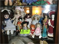 MIDDLE SHELF CURIO CABINET WITH DOLLS