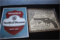 Two Smith & Wesson Metal Signs