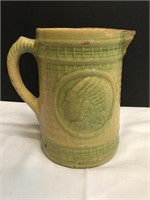 Early Stoneware Pitcher with Indian