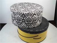 2 hat boxes with a ladies hat