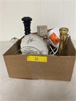Box filled with a vase whiskey bottle, plate and
