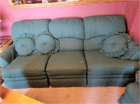 Green reclining sofa