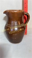 Very old brown stoneware pitcher