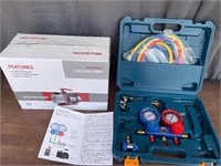 Vacuum pump and refrigerant kit