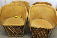 Four Mexican Equipal Leather Barrel Chairs