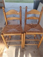 set of 2 bar stools. some wicker needs repaired