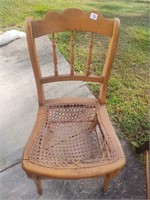 antique cane chair, has damage