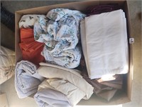 large box full of queen sheet sets