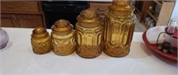 Vintage set of 4 amber glass canisters