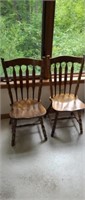 Two vintage solid wood dining chairs
