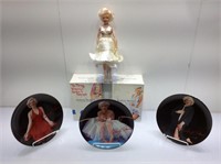 Marilyn Monroe doll, collectible plate, DVDs.
