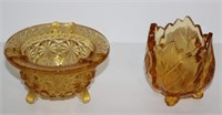 two small footed amber glass bowls