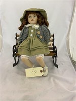 Doll sitting on bench