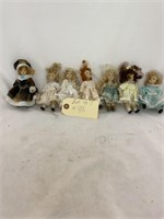 7 Little Porcelain Dolls