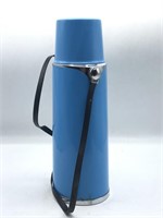 Vintage blue thermos with carrying strap
