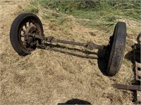 ANTIQUE AXLE WITH WOOD SPOKED WHEELS