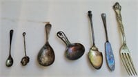 Assorted silver plated spoons, knife and fork.