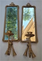 Copper colored candle sconces with mirrors