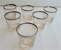 Rocks glasses with silver rims.