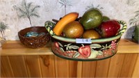 Lot of decorative fruit, eggs, and container