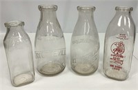 Four Milk Bottles