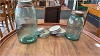 2 blue Ball mason jars with zinc lids and 4 extra