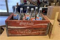2 Coke trays stacked w! 6 Pepsi 32 oz bottles