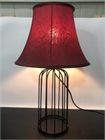 Black metal lamp with burgundy patterned shade