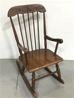 Brown wooden stained rocking chair for children