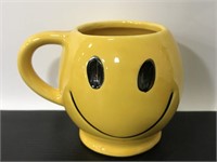 Yellow ceramic smiley face mug