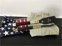 Pair of canvas aprons and grilling utensils