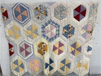 Vintage quilted blanket with hexagon pattern