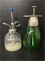 Pair of glass soap dispensers with metal pump