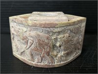 Stone box with animal carved pattern