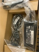 Box of ac adaptors in individual boxes . New