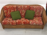 Very nice wicker couch w flower pattern cushions