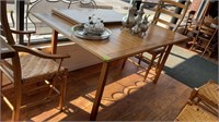 Light brown wood dining room table with two