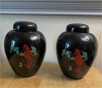 Two decorative Black Urns displaying Cardinals-