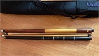 Two vintage pool sticks, 1 is marked Dufferin