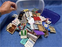Container of vintage advertising matches