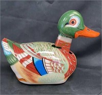 Vintage friction powered tin duck toy measures 8