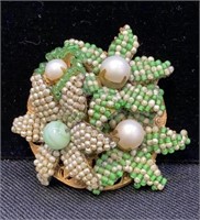 Vintage Mariam Haskell pin with green and