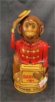 Vintage tin monkey bank stands 5 1/2 inches