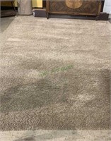 Large room size tan shag carpet measures 94 x