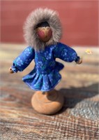 Alaskan Native doll on a wooden stand in good cond