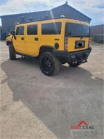 2003 Yellow Hummer H2 with a 6.0L V8 OHV 16V