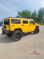 2003 Yellow Hummer H2 with a 6.0L V8 OHV 16V