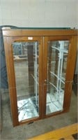 mirrored display case with glass shelves