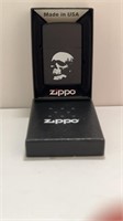 Black Zippo With Skull Design.
