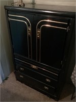 Black and gold armoire